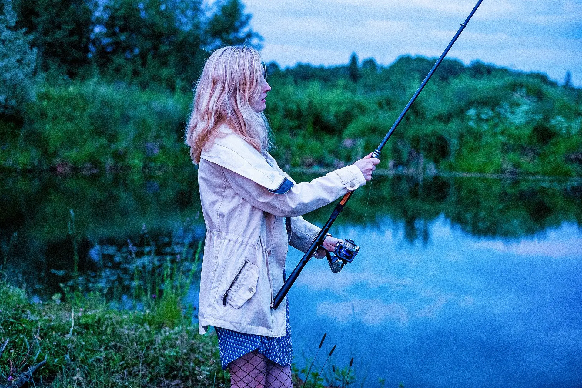 Girl fishing in a pong