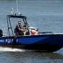 A law enforcement boat running on the water