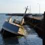 A boat capsized near a dock