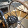 A boat steering wheel on a sailboat