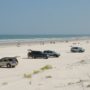 SUV's parked along the beach