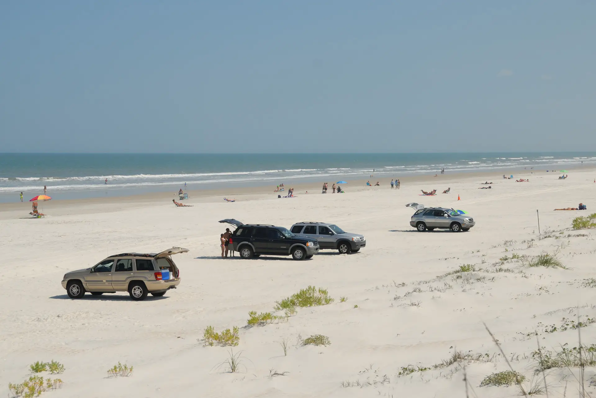 SUV's parked along the beach