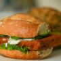 A fish sandwich with lettuce and tartar sauce